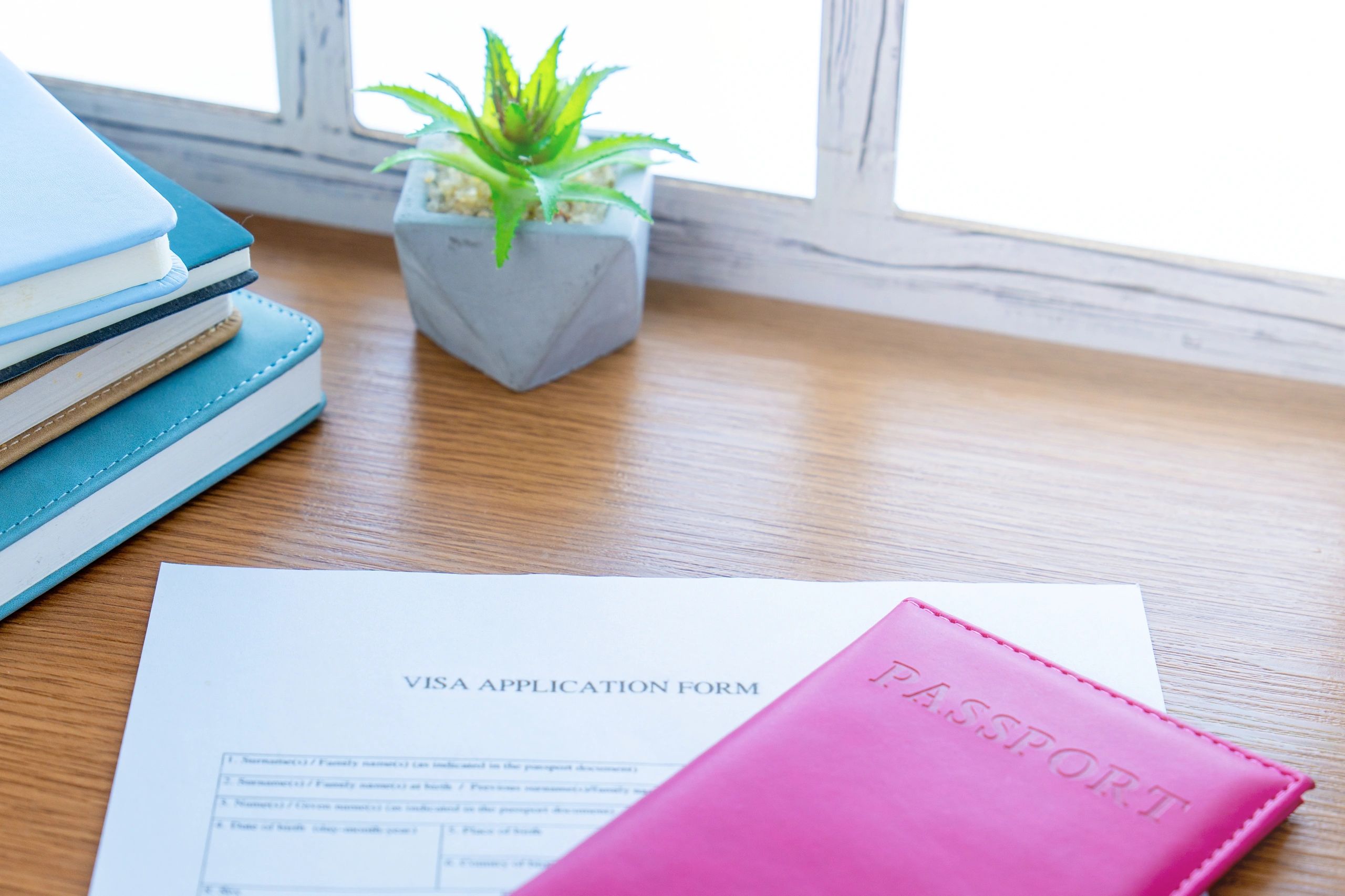 Passport and visa application form on a desk