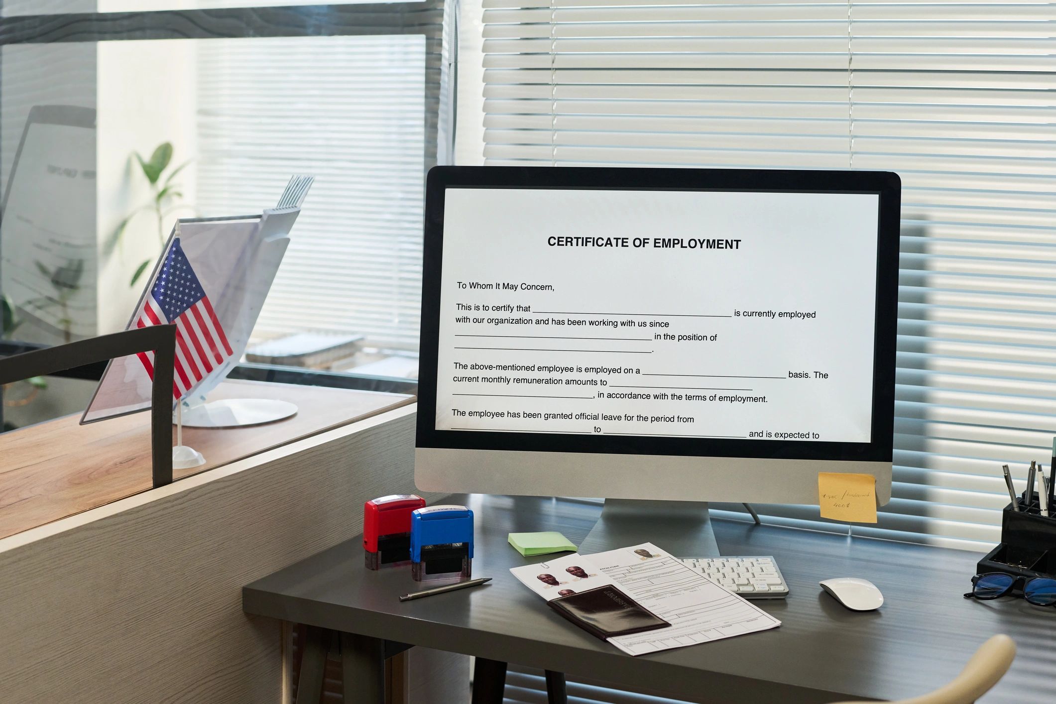 Visa center office desk with documents and computer